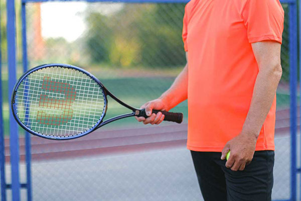 Tennis Man Orange Shirt