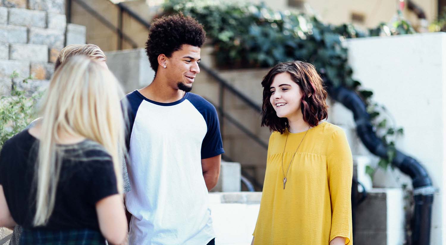 Three teenagers talking